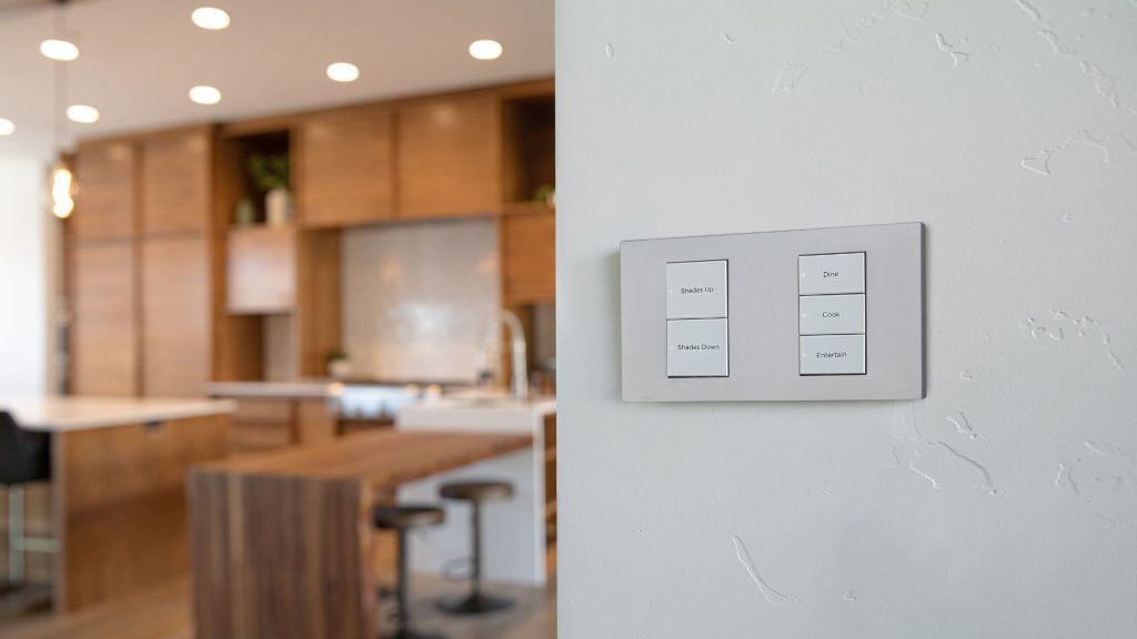 Control4 custom engraved keypad interface in luxury kitchen.